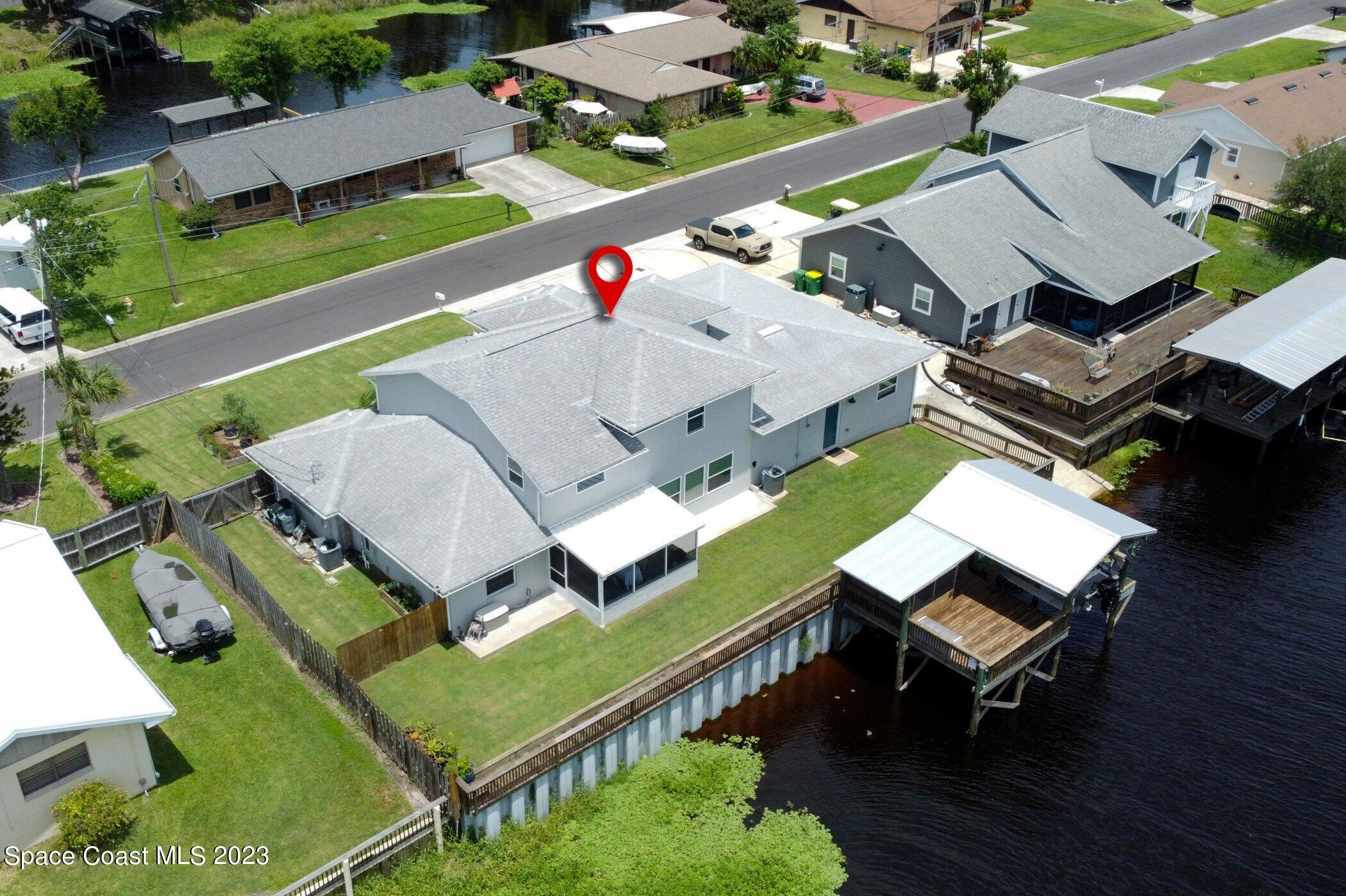 834 Egret Road Cocoa, FL 32926 - Photo 70 of 85 an aerial view of a house with pool patio and outdoor seating