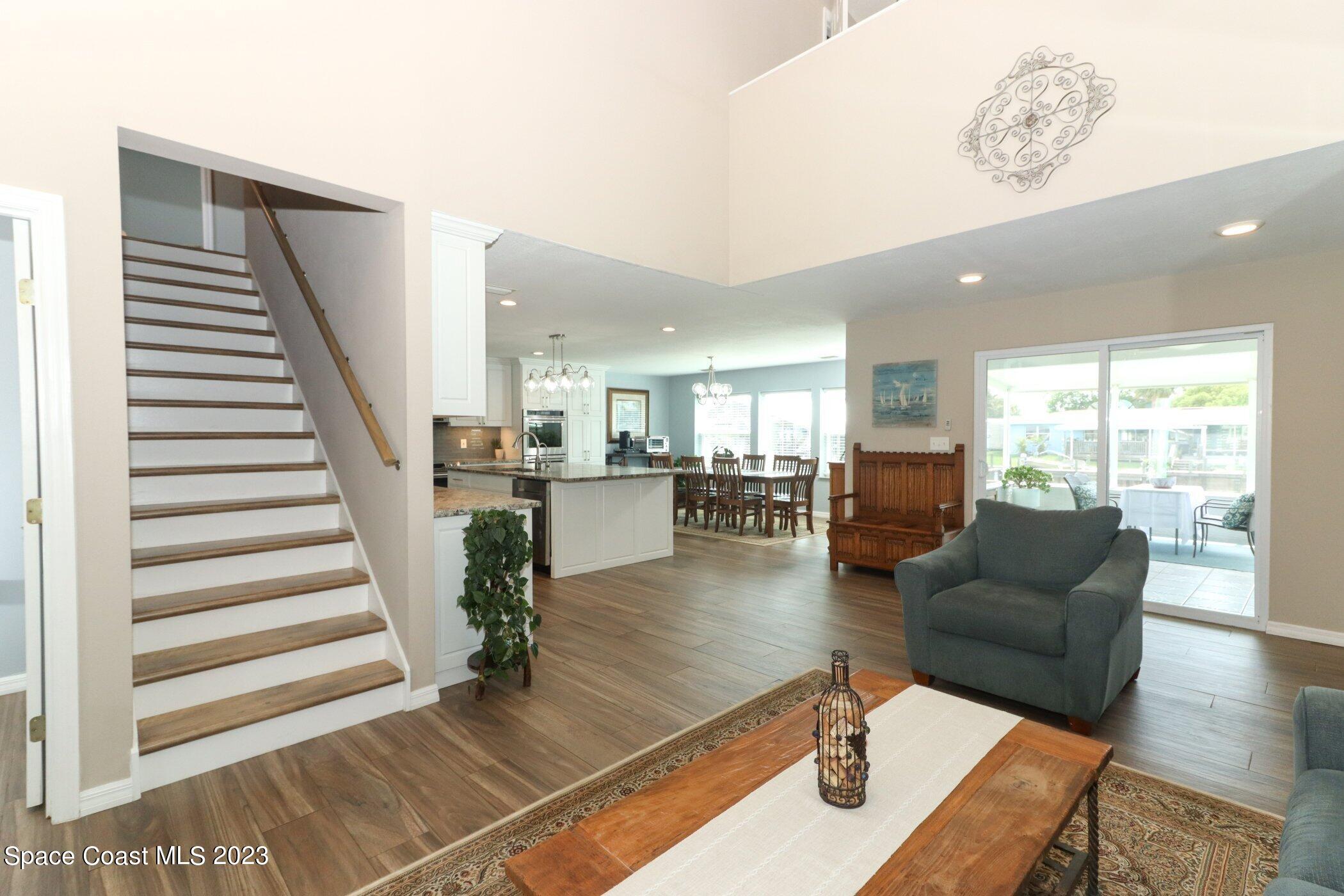834 Egret Road Cocoa, FL 32926 - Photo 7 of 85 a living room with furniture and a wooden floor