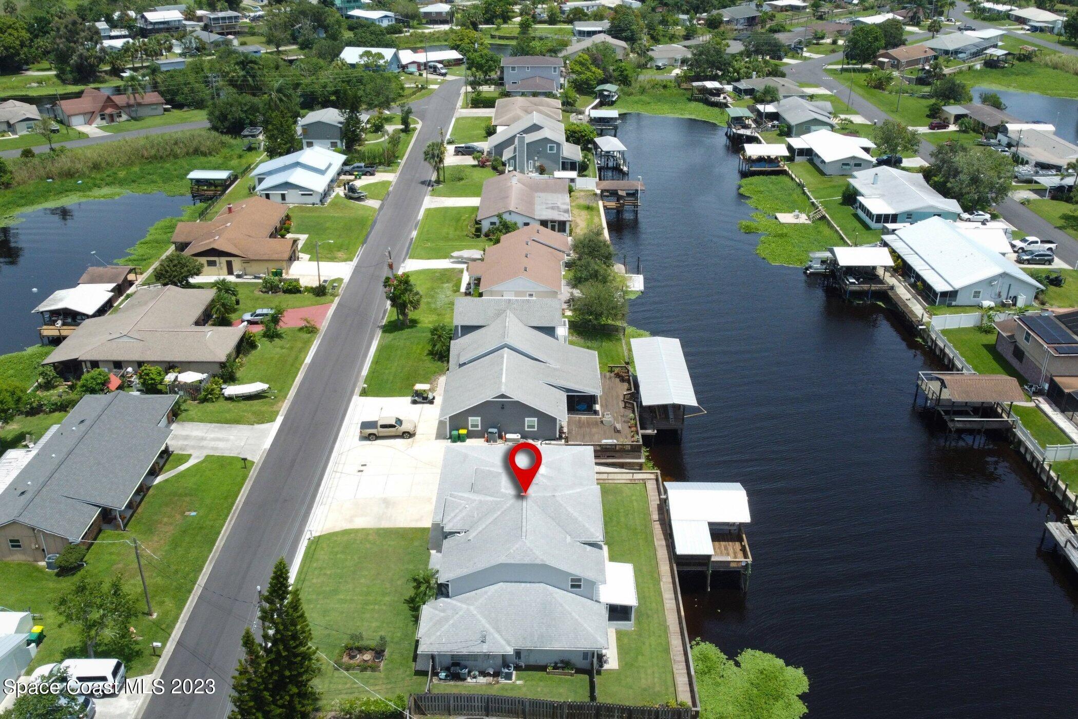 834 Egret Road Cocoa, FL 32926 - Photo 74 of 85 an aerial view of residential houses with outdoor space and street view