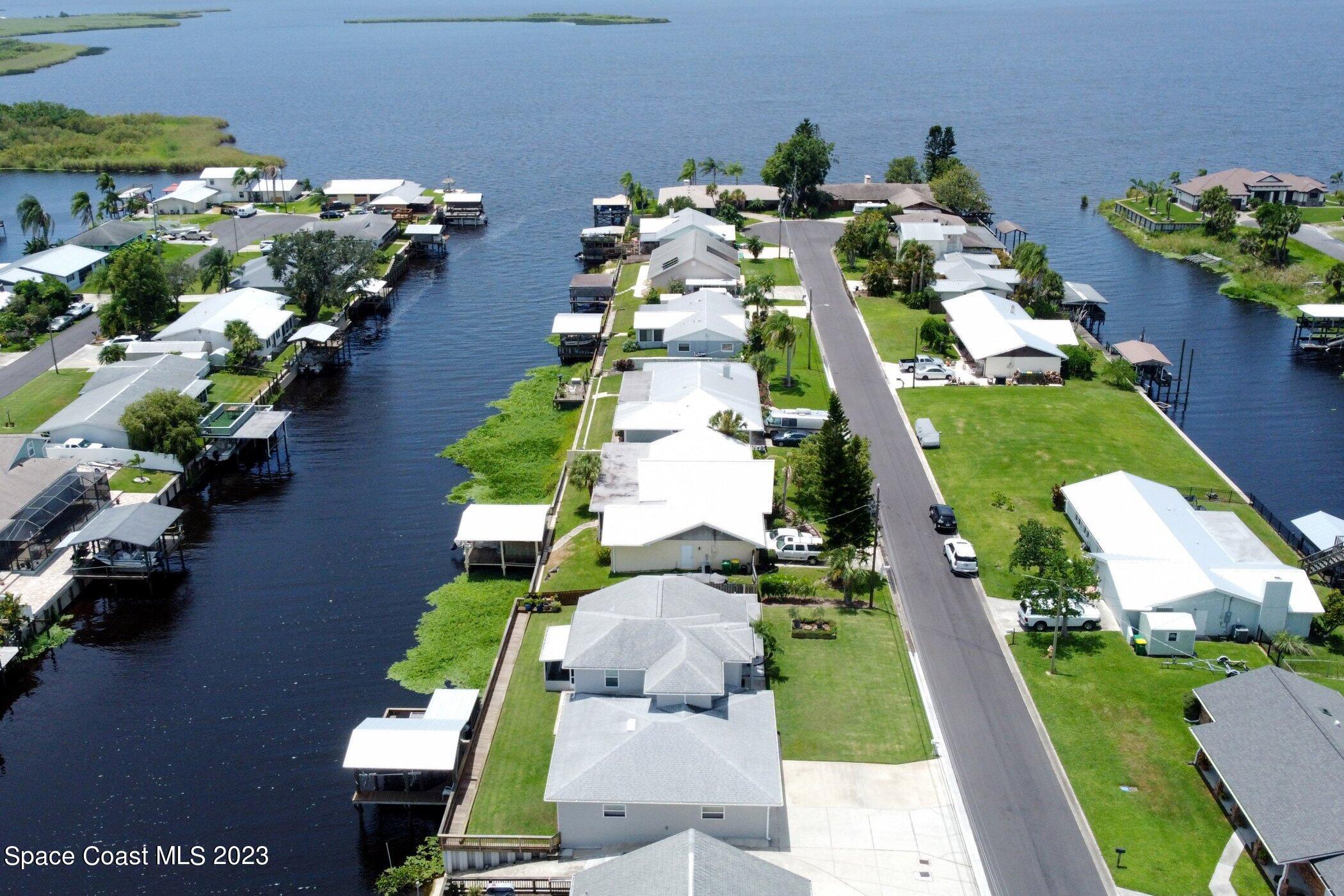 834 Egret Road Cocoa, FL 32926 - Photo 83 of 85 an aerial view of a house with a garden potted plants
