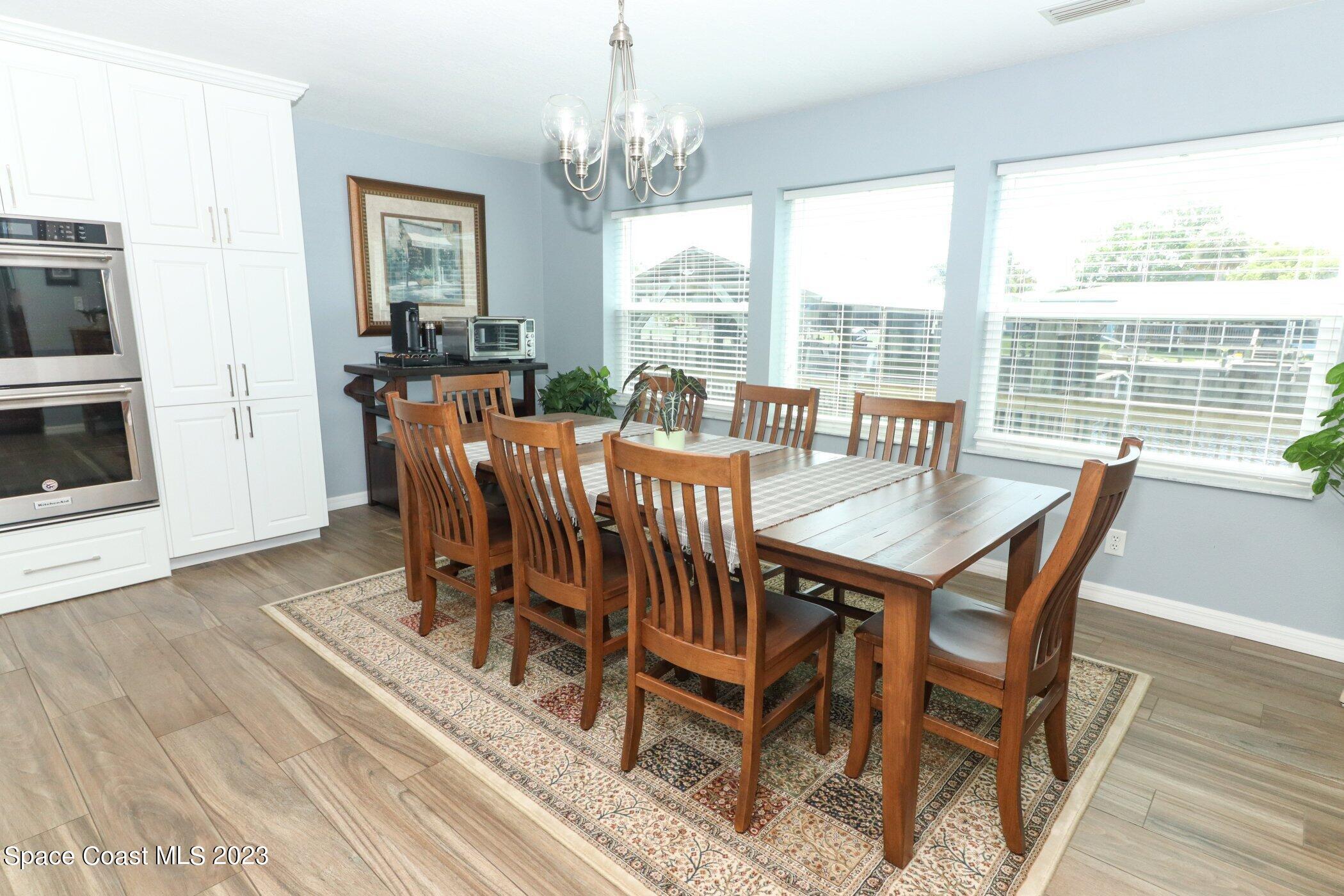 834 Egret Road Cocoa, FL 32926 - Photo 9 of 85 a view of a dining room with furniture window and outside view