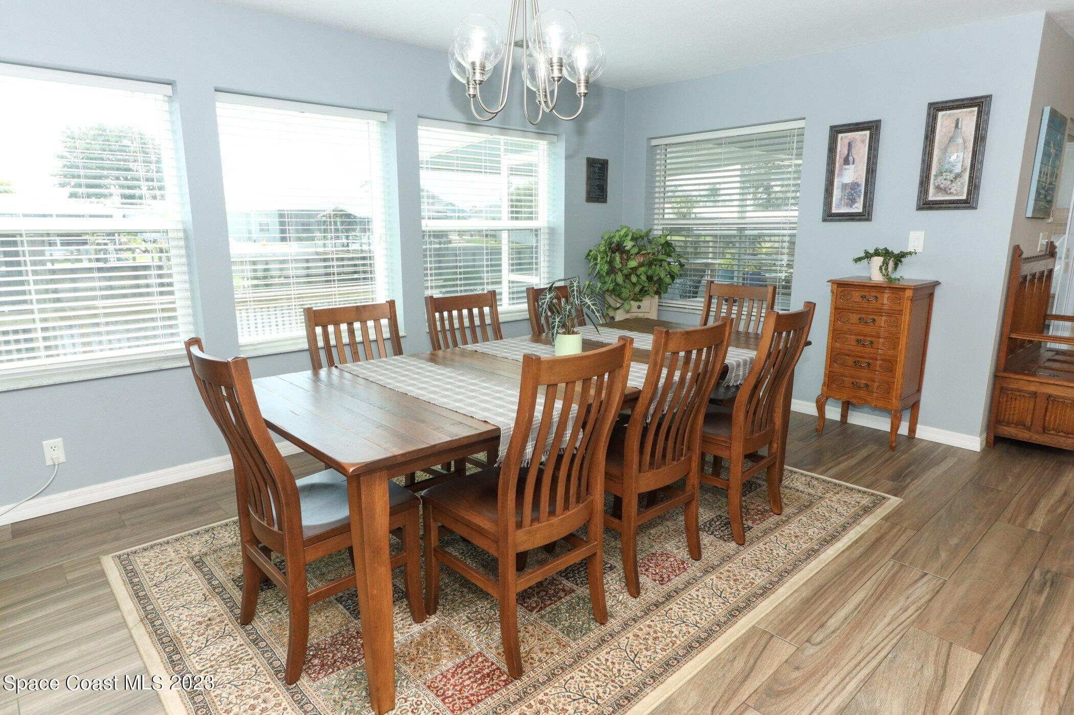 834 Egret Road Cocoa, FL 32926 - Photo 10 of 85 a view of a dining room with furniture window and wooden floor