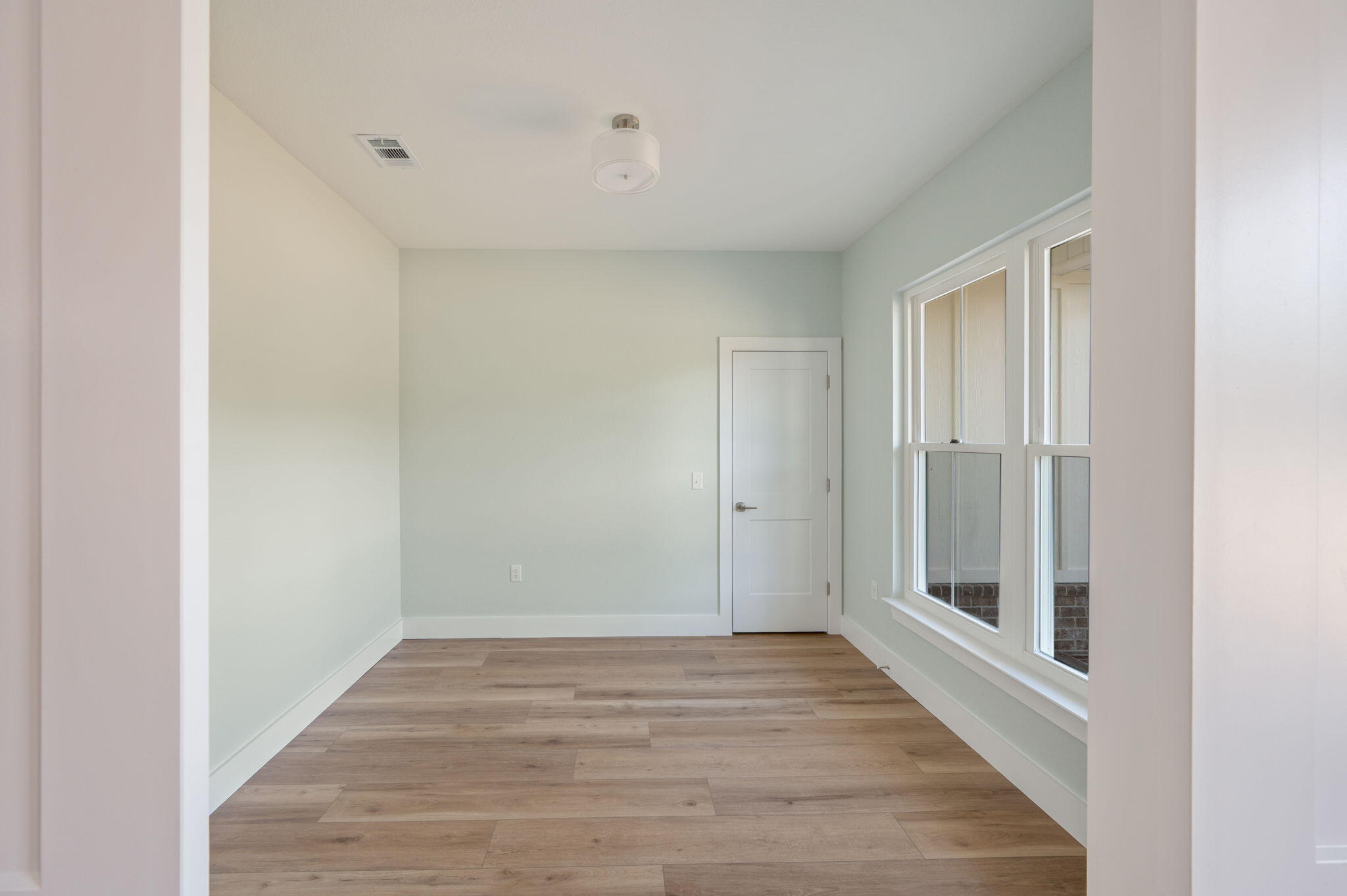 3504 Plympton Road Laurel Hill, FL 32567 - Photo 11 of 62 a view of a hallway with wooden floor
