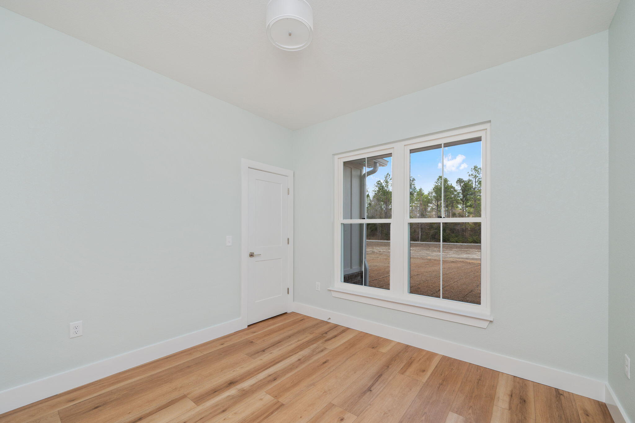 3504 Plympton Road Laurel Hill, FL 32567 - Photo 12 of 62 a view of empty room with wooden floor and fan