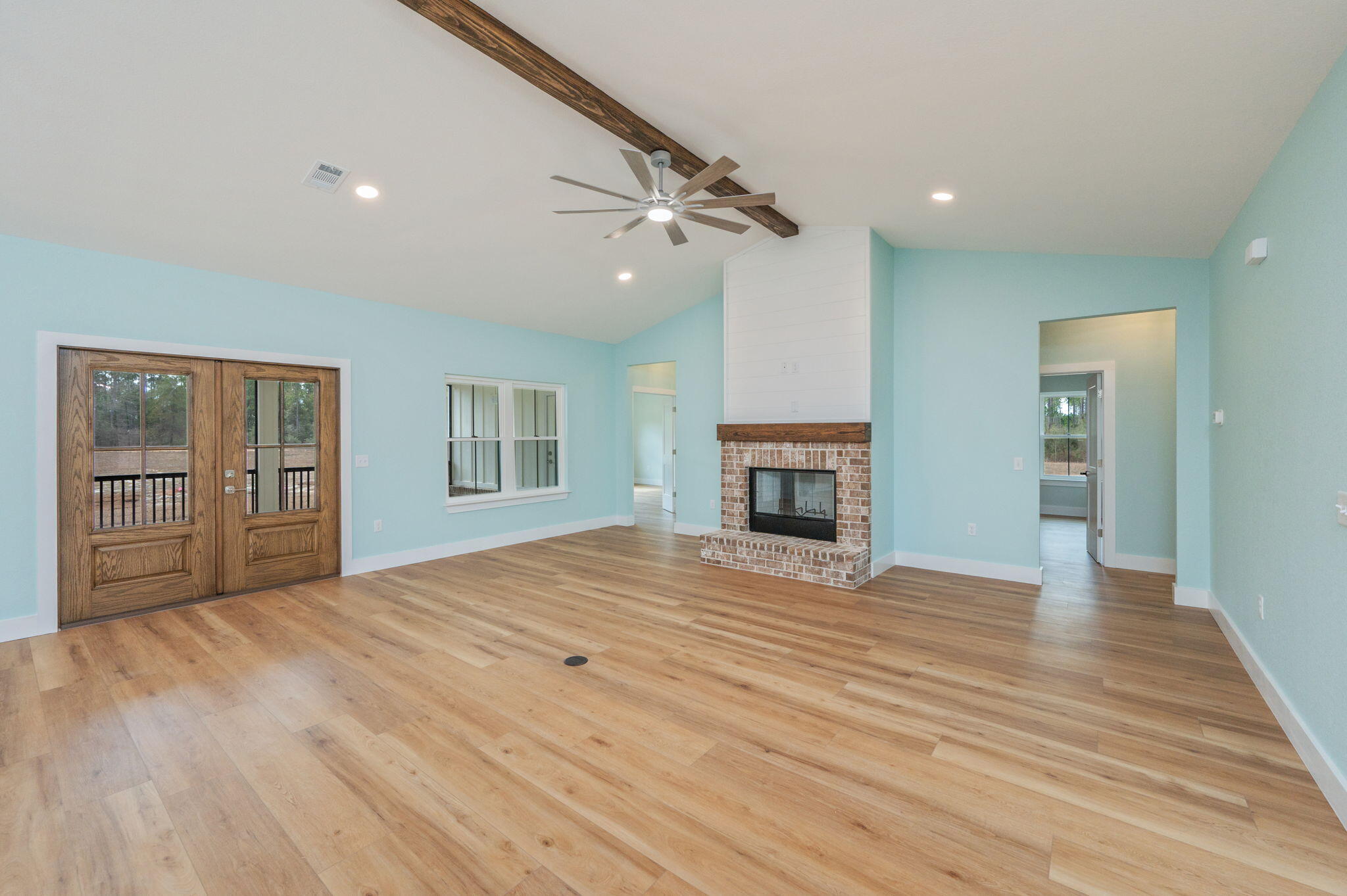 3504 Plympton Road Laurel Hill, FL 32567 - Photo 21 of 62 a view of an empty room with window and wooden floor