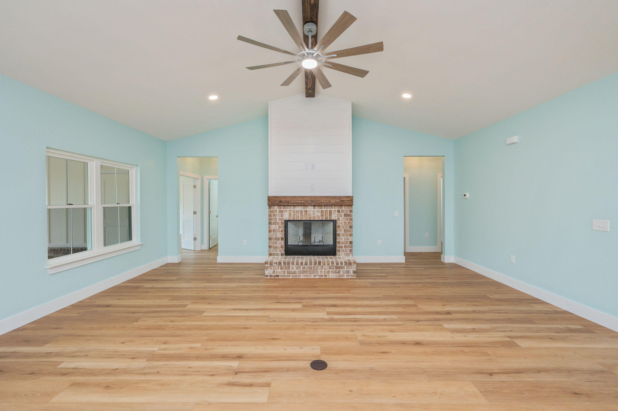 3504 Plympton Road Laurel Hill, FL 32567 - Photo 22 of 62 a view of an empty room with a fireplace and a window
