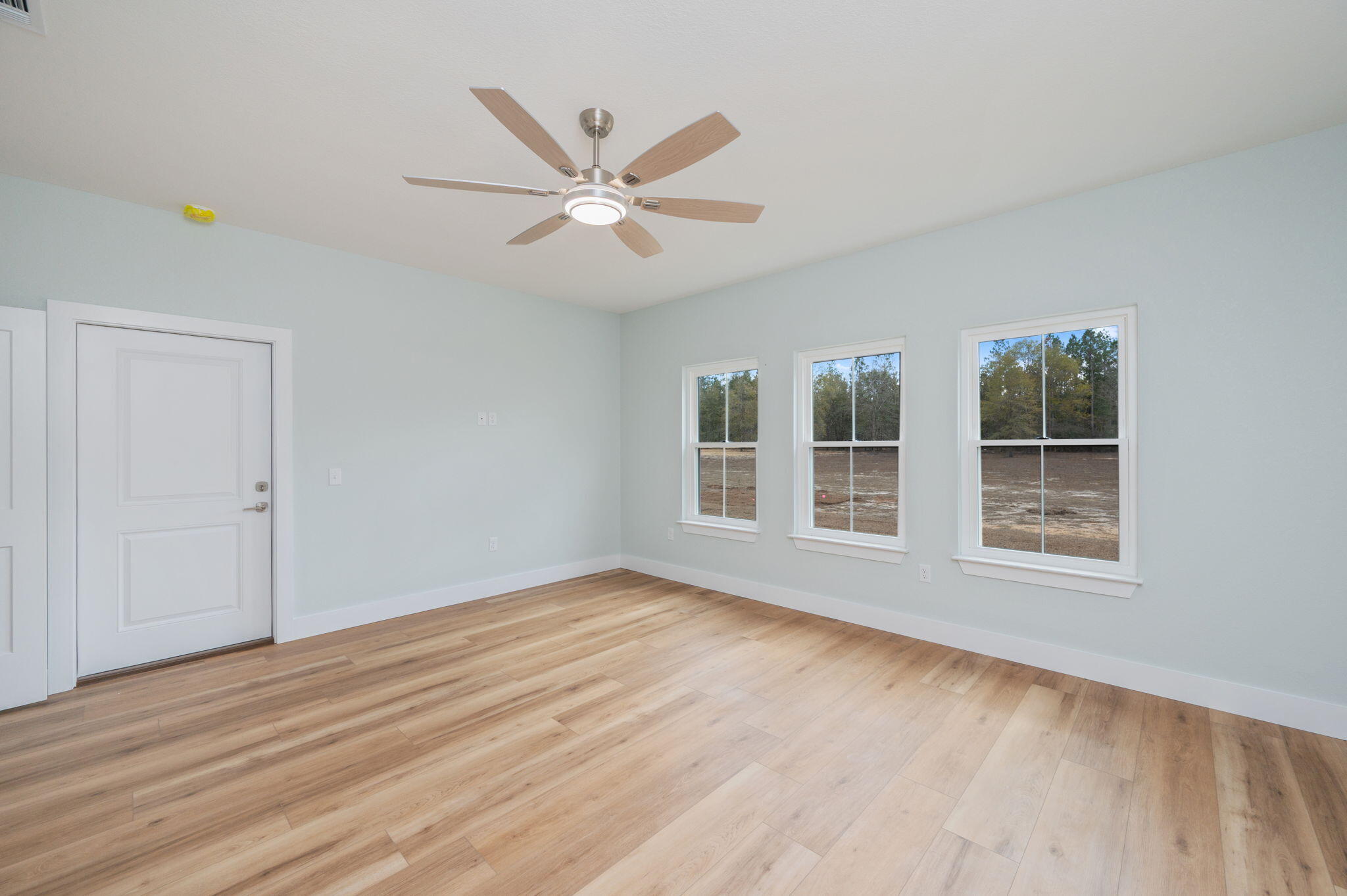 3504 Plympton Road Laurel Hill, FL 32567 - Photo 27 of 62 a view of empty room with wooden floor and fan