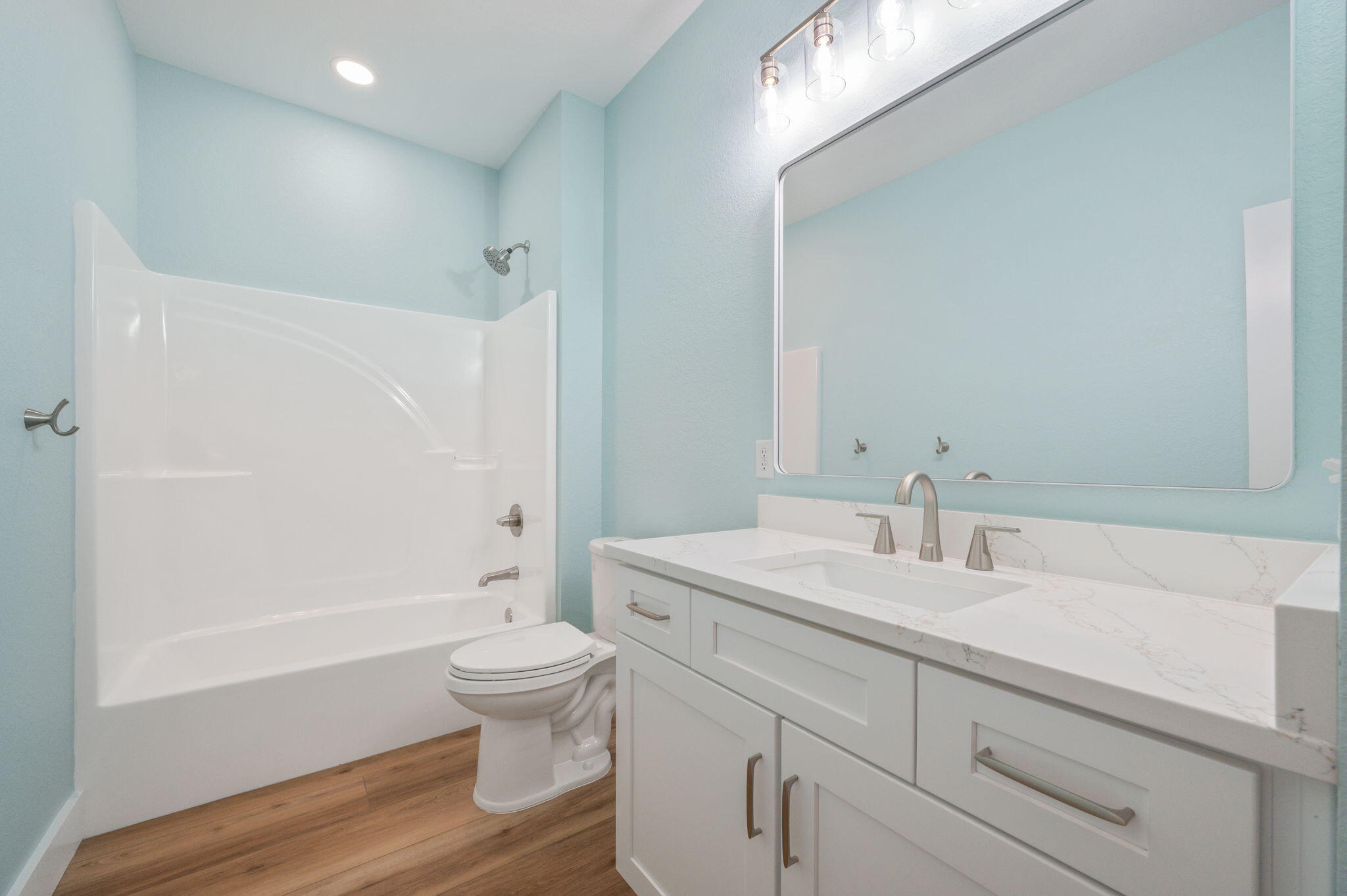 3504 Plympton Road Laurel Hill, FL 32567 - Photo 29 of 62 a bathroom with a sink a toilet and a large mirror