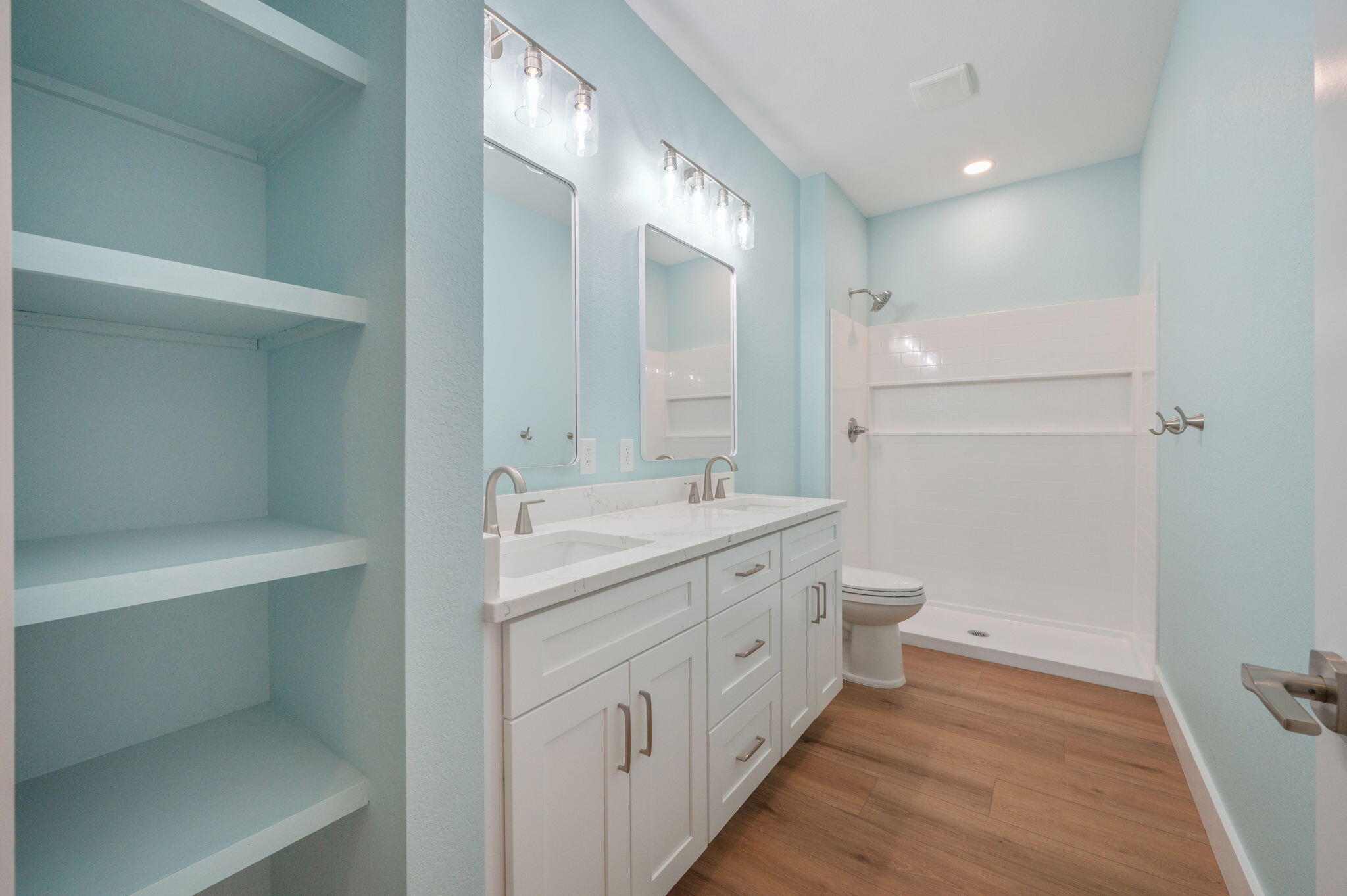 3504 Plympton Road Laurel Hill, FL 32567 - Photo 35 of 62 a bathroom with a double vanity sink toilet and shower
