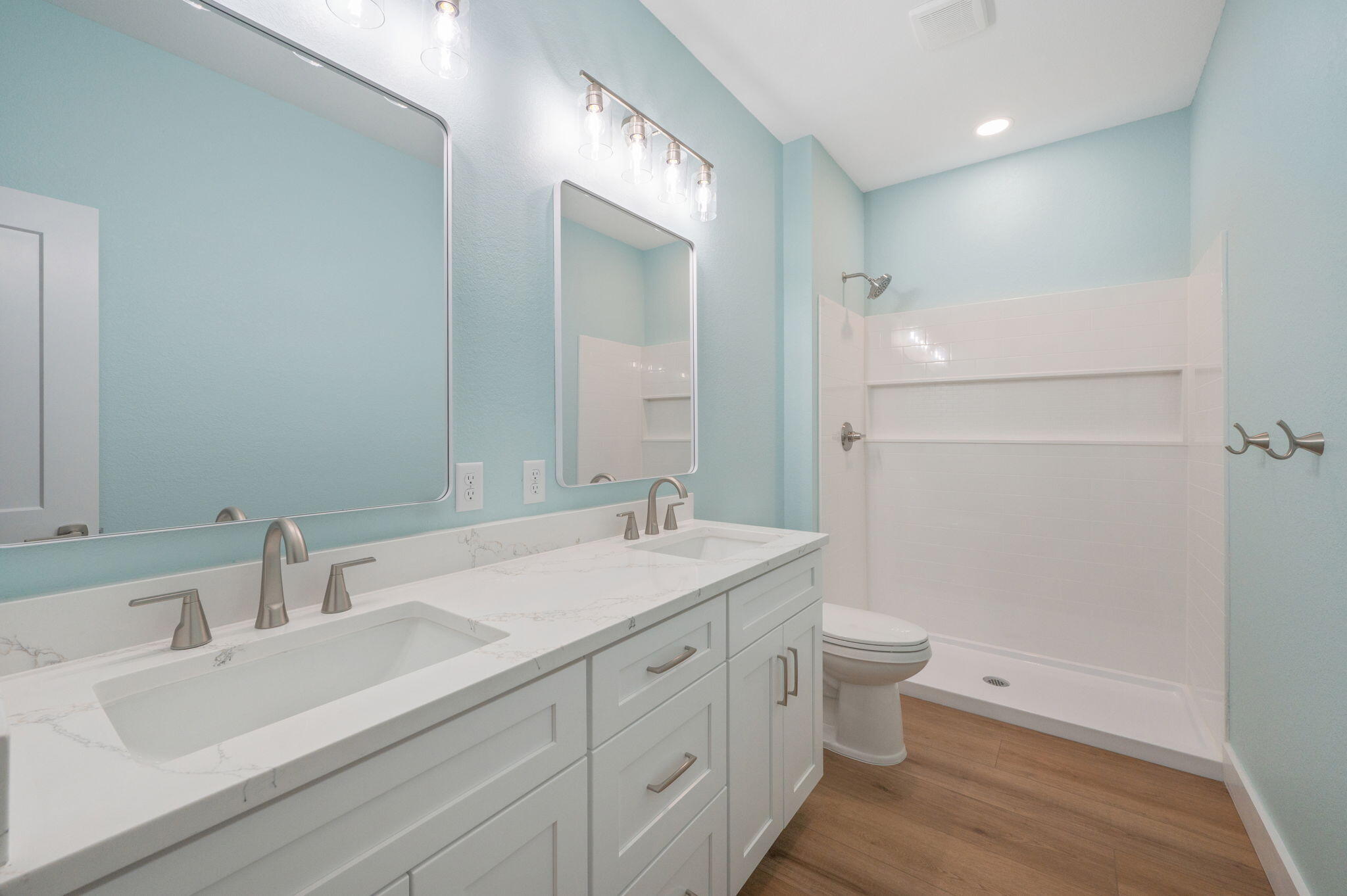 3504 Plympton Road Laurel Hill, FL 32567 - Photo 36 of 62 a bathroom with a sink a toilet a large mirror and shower