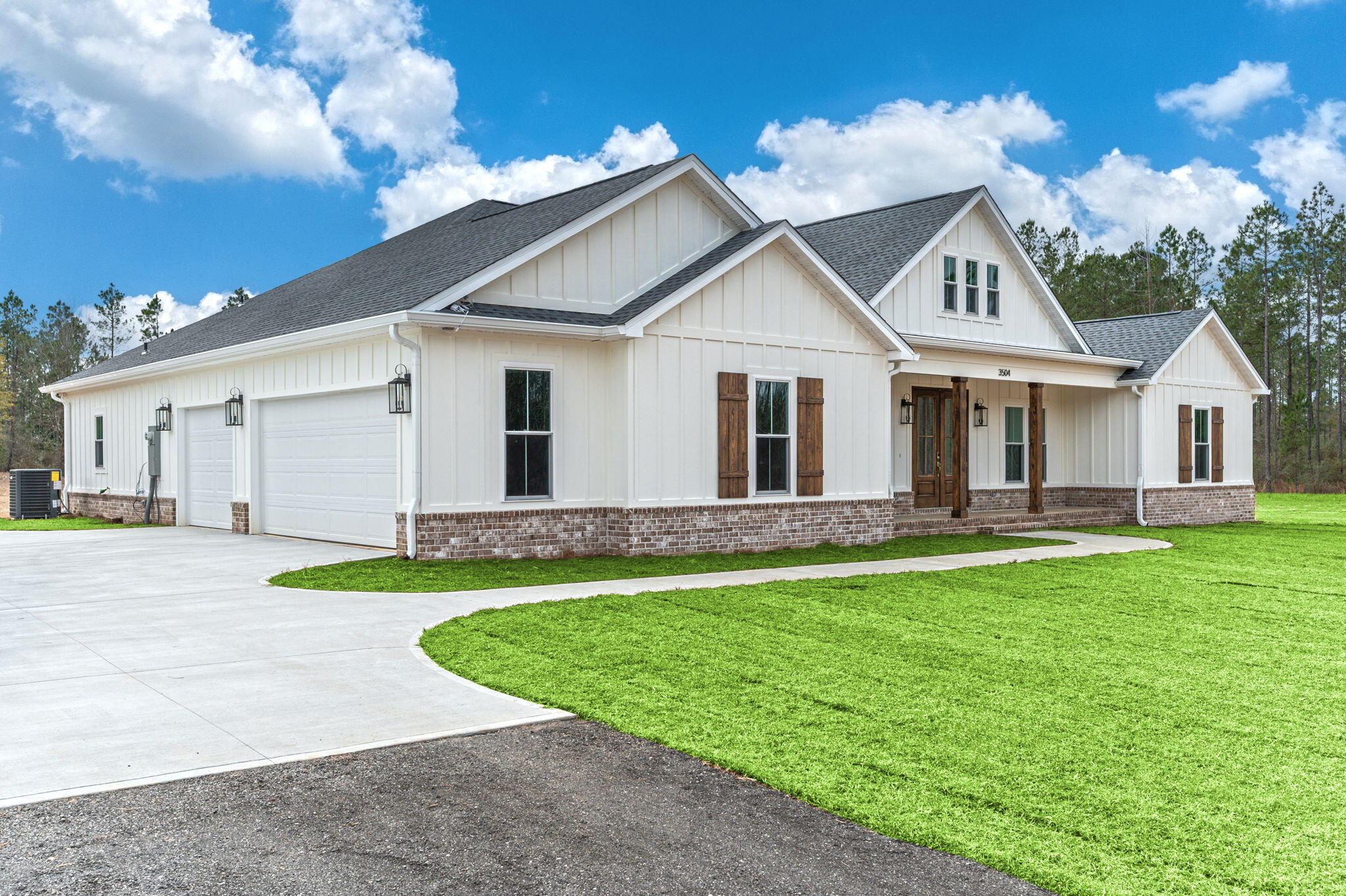 3504 Plympton Road Laurel Hill, FL 32567 - Photo 4 of 62 a view of a house with a big yard potted plants and large tree