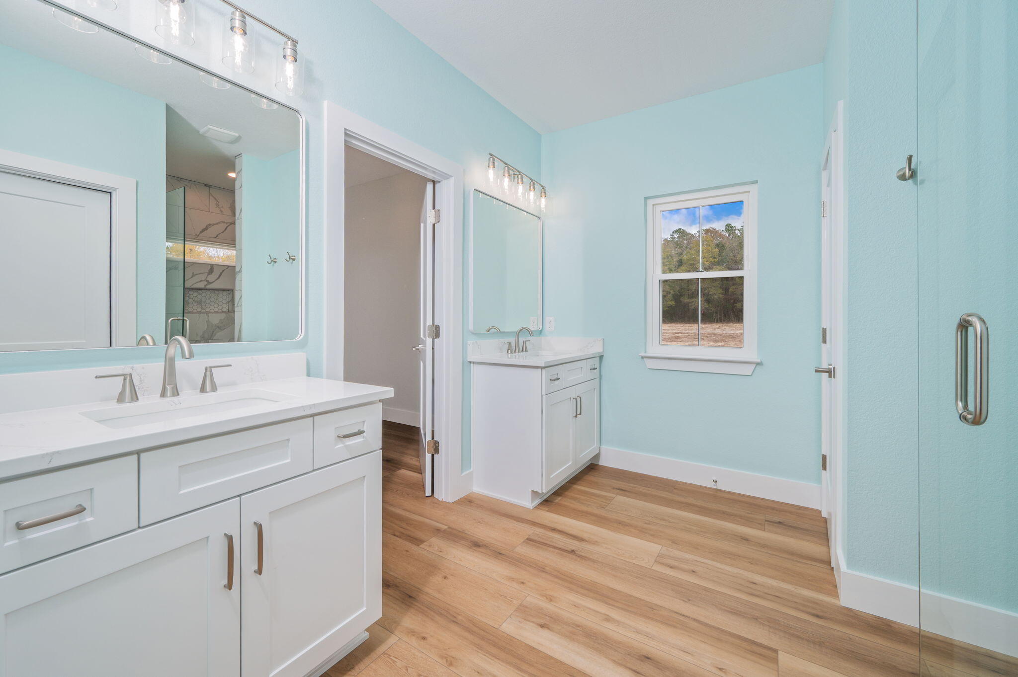 3504 Plympton Road Laurel Hill, FL 32567 - Photo 42 of 62 a bathroom with a sink a toilet a shower and a mirror