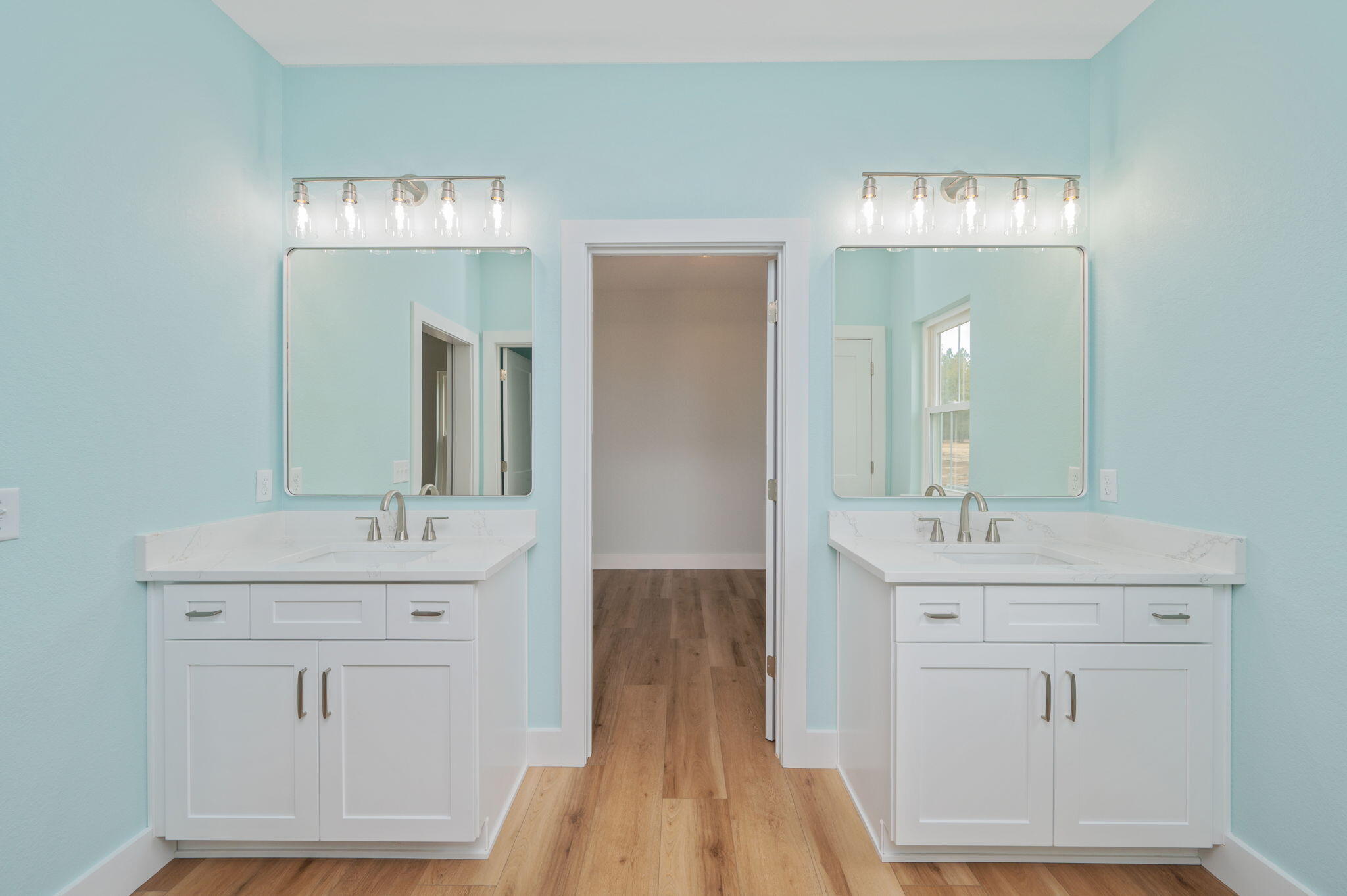 3504 Plympton Road Laurel Hill, FL 32567 - Photo 49 of 62 a bathroom with double vanity sink a mirror and vanity