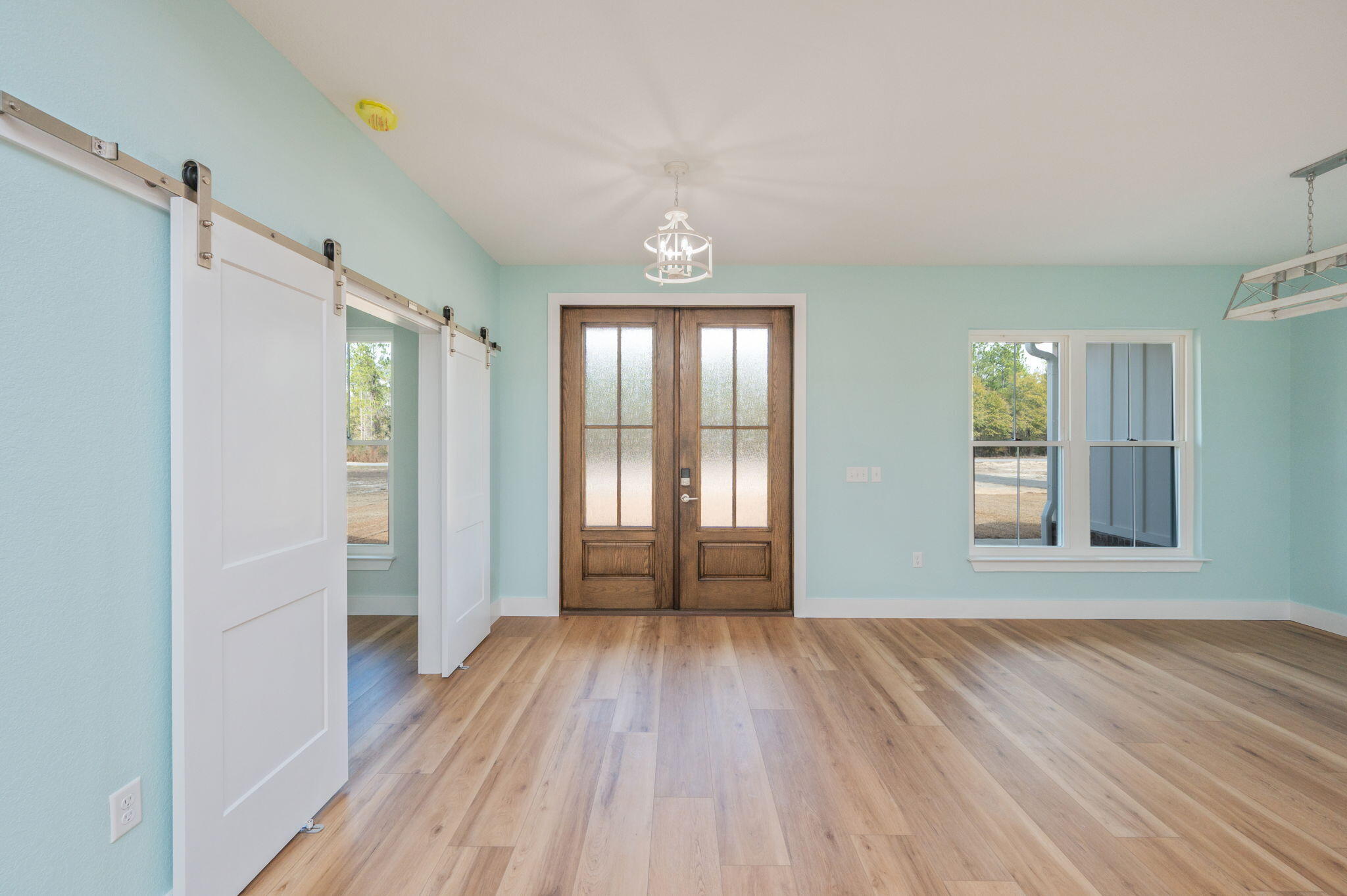 3504 Plympton Road Laurel Hill, FL 32567 - Photo 8 of 62 a view of empty room with wooden floor and fan