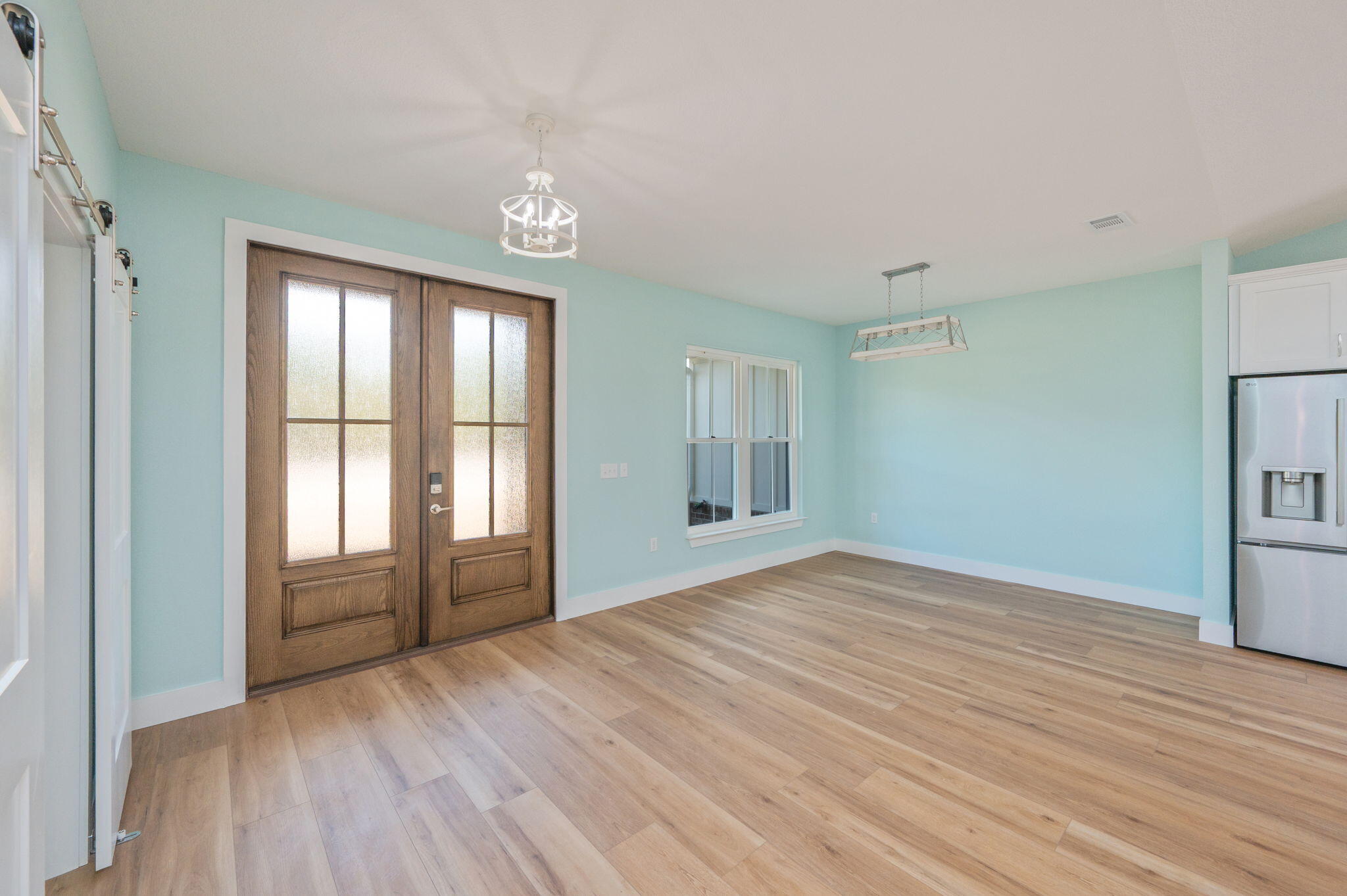 3504 Plympton Road Laurel Hill, FL 32567 - Photo 9 of 62 a view of an empty room with wooden floor and a window