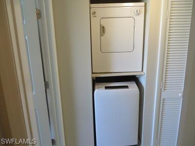 3806 Guilford Road, Unit 101 Naples, FL 34112 - Photo 12 of 19 a utility room with dryer and washer