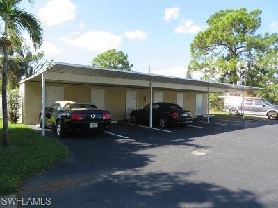 3806 Guilford Road, Unit 101 Naples, FL 34112 - Photo 14 of 19 a view of a car parked in front of a house