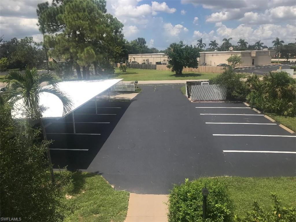 3806 Guilford Road, Unit 101 Naples, FL 34112 - Photo 17 of 19 a view of a lake