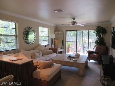 3806 Guilford Road, Unit 101 Naples, FL 34112 - Photo 5 of 19 a living room with furniture and a large window