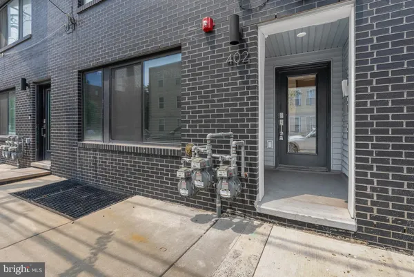 a view of a brick house with an empty space