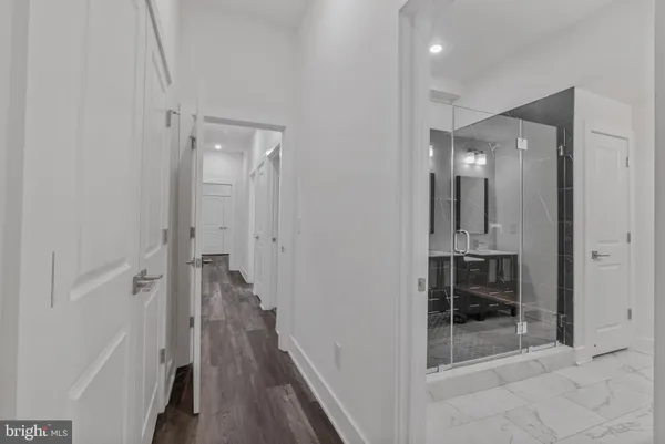 a bathroom with a mirror and a shower