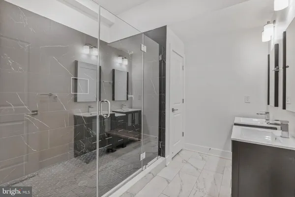 a bathroom with a sink and mirror