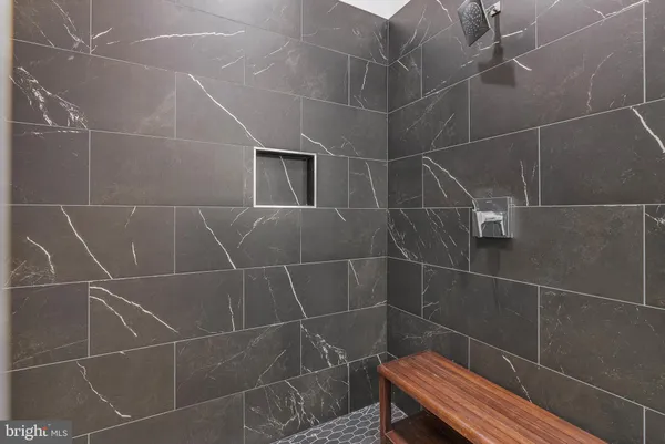 a bathroom with a sink toilet and a shower