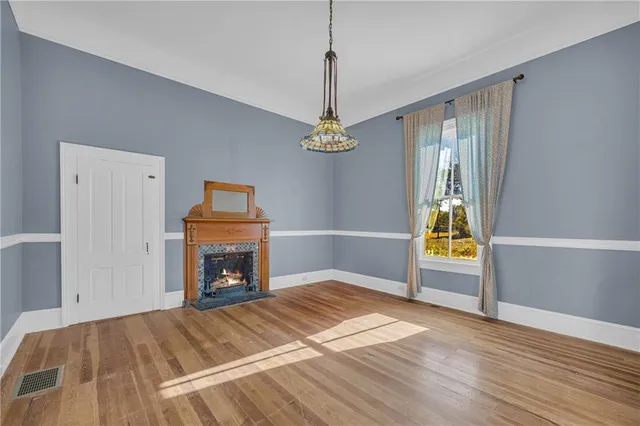 a bedroom with a bed and a fireplace