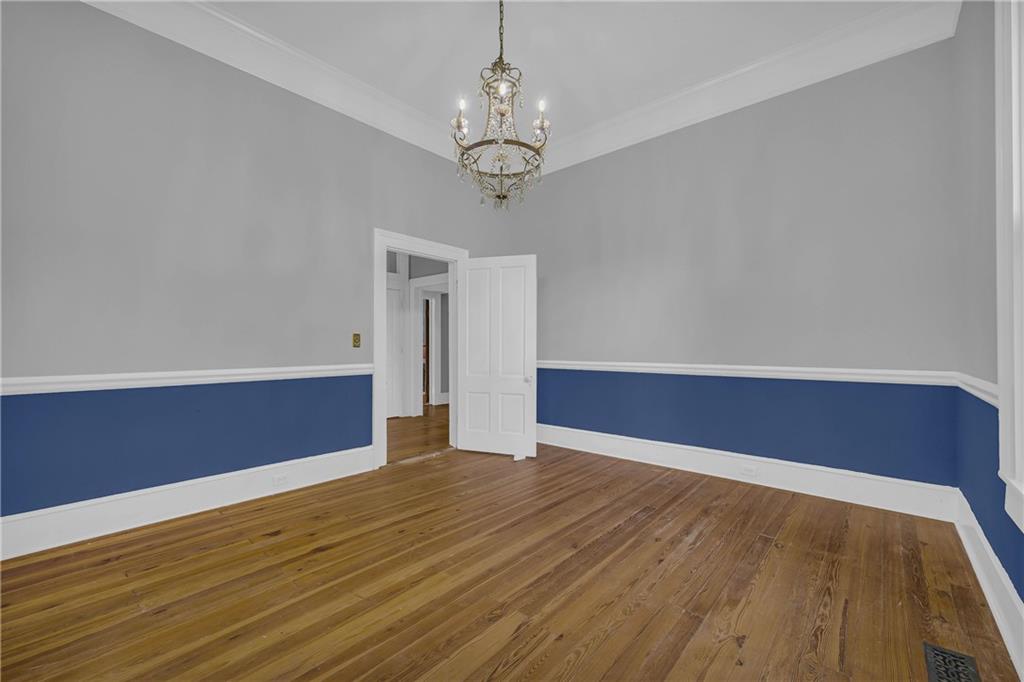 5921 Bostwick Road Bishop, GA 30621 - Photo 17 of 65 a view of wooden floor and chandelier in a room