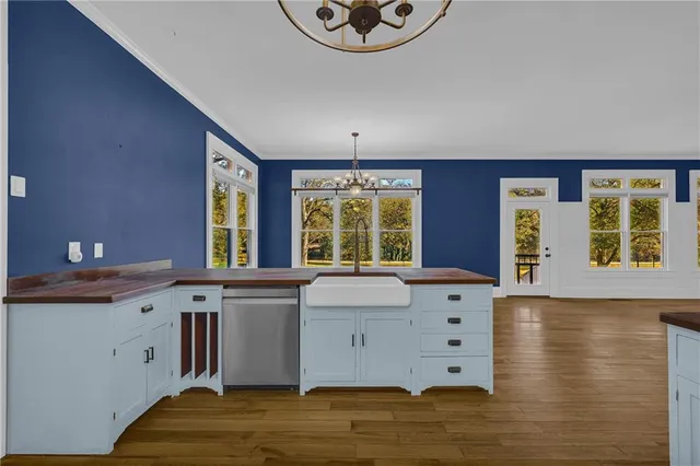 a kitchen with stainless steel appliances granite countertop a stove and a refrigerator