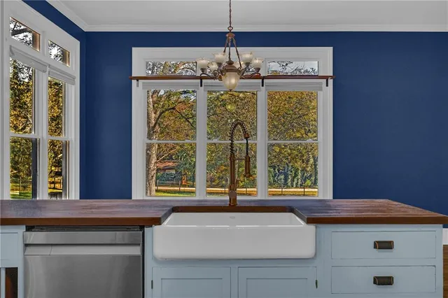 a kitchen with a stove and a kitchen island