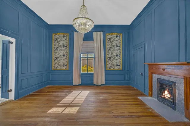 a white bath tub sitting next to a small window