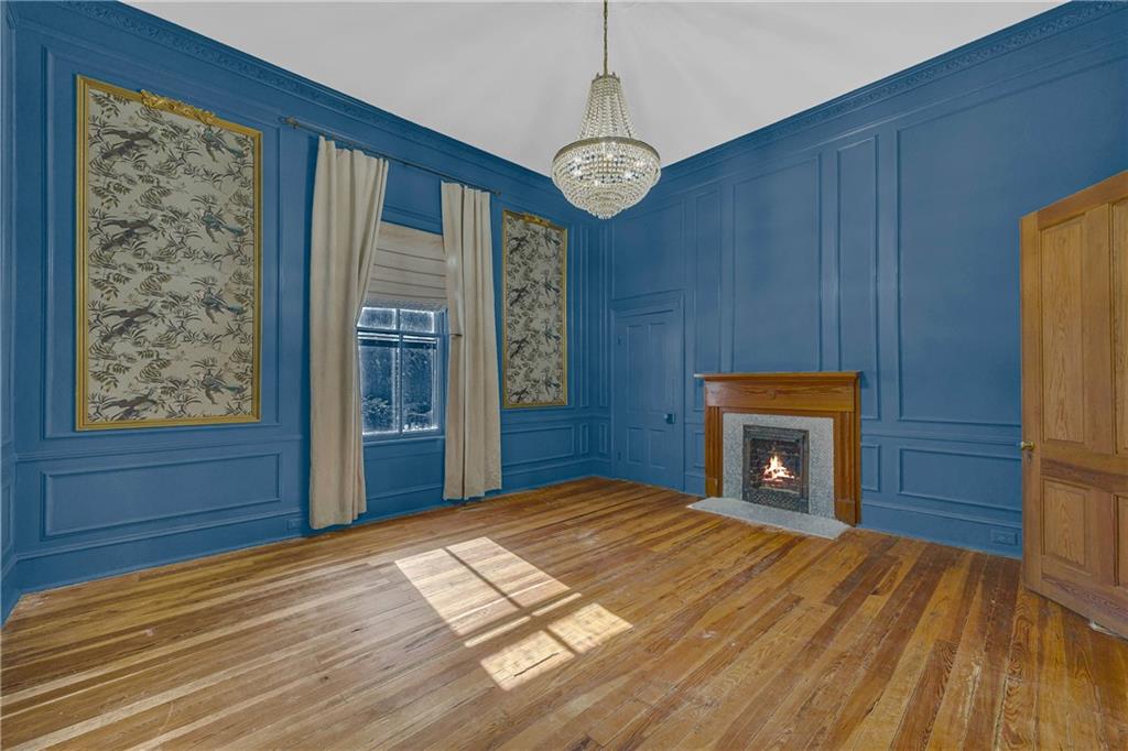 5921 Bostwick Road Bishop, GA 30621 - Photo 31 of 65 a bedroom with a bed and a fireplace