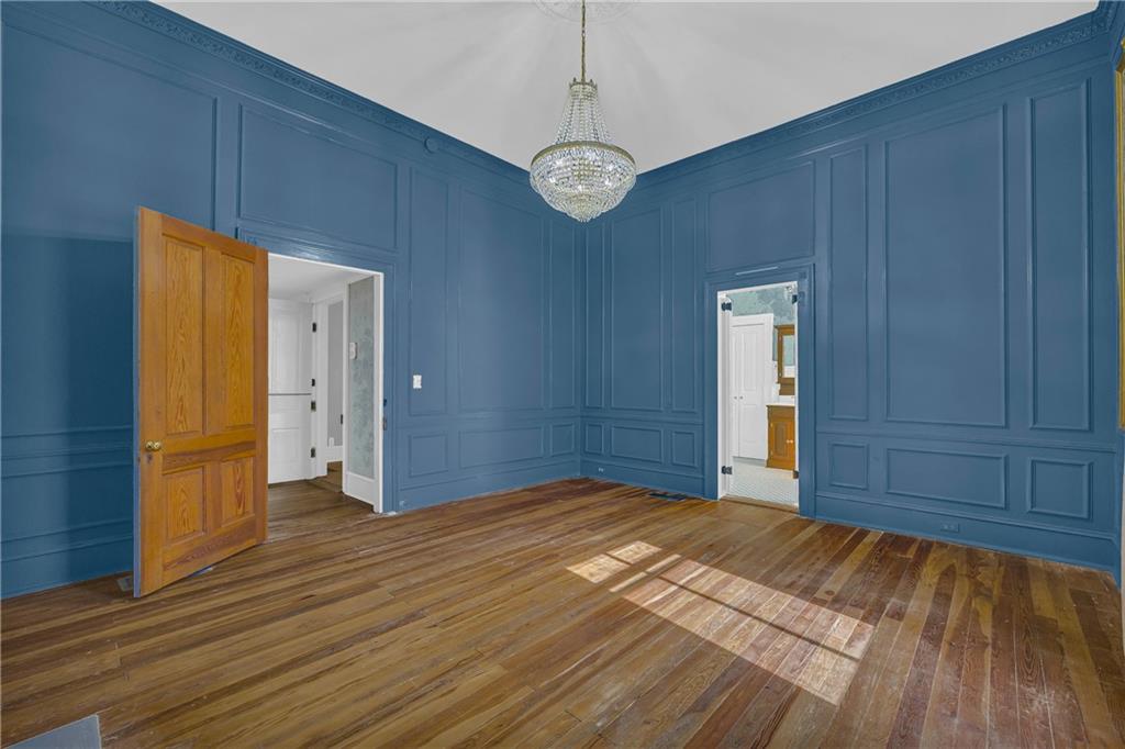 5921 Bostwick Road Bishop, GA 30621 - Photo 32 of 65 a view of an empty room with wooden floor