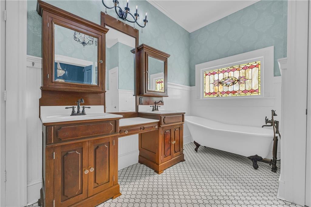 5921 Bostwick Road Bishop, GA 30621 - Photo 33 of 65 a spacious bathroom with a double vanity sink a mirror and a bathtub