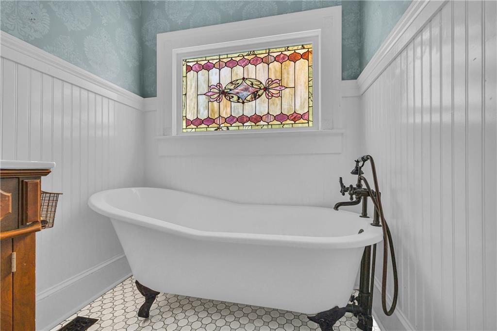 5921 Bostwick Road Bishop, GA 30621 - Photo 34 of 65 a white bath tub sitting next to a small window