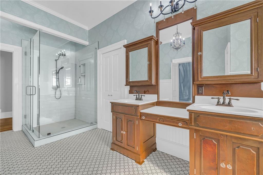 5921 Bostwick Road Bishop, GA 30621 - Photo 35 of 65 a bathroom with a sink a toilet and shower