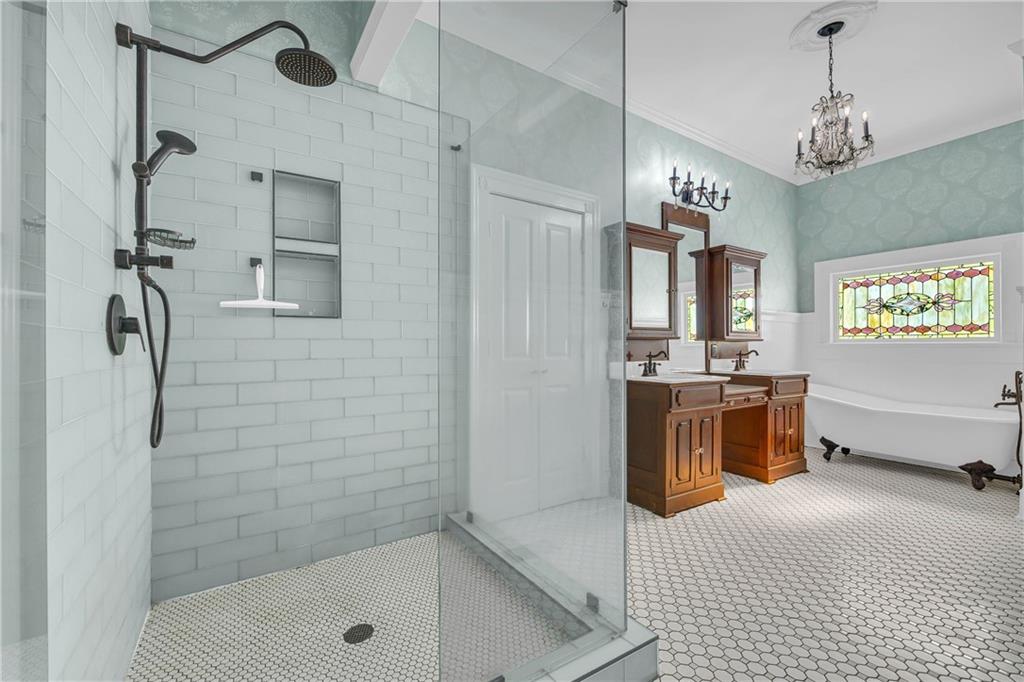 5921 Bostwick Road Bishop, GA 30621 - Photo 36 of 65 a spacious bathroom with a tub sink a mirror and shower