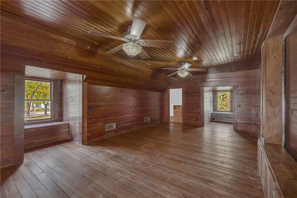 5921 Bostwick Road Bishop, GA 30621 - Photo 38 of 65 a view of an empty room with window and wooden floor