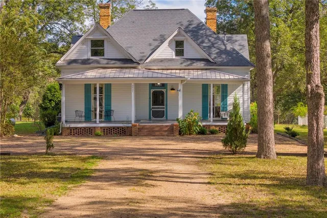a view of a house with a swimming pool