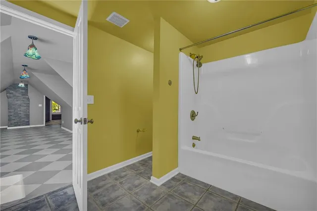 a house that has a tree in front of it