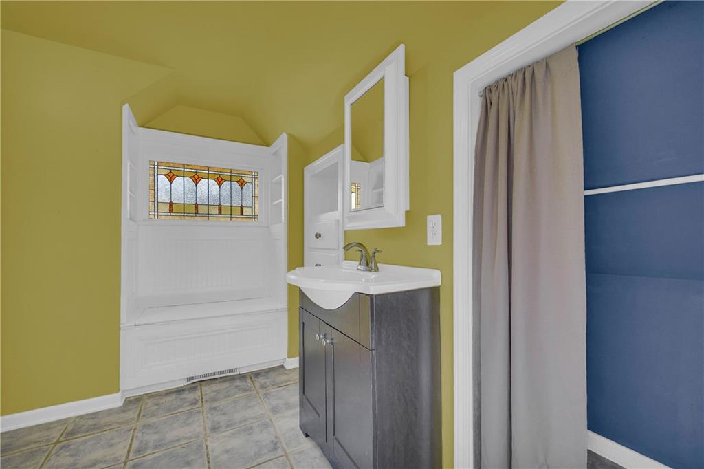 5921 Bostwick Road Bishop, GA 30621 - Photo 45 of 65 a bathroom with a sink and a mirror