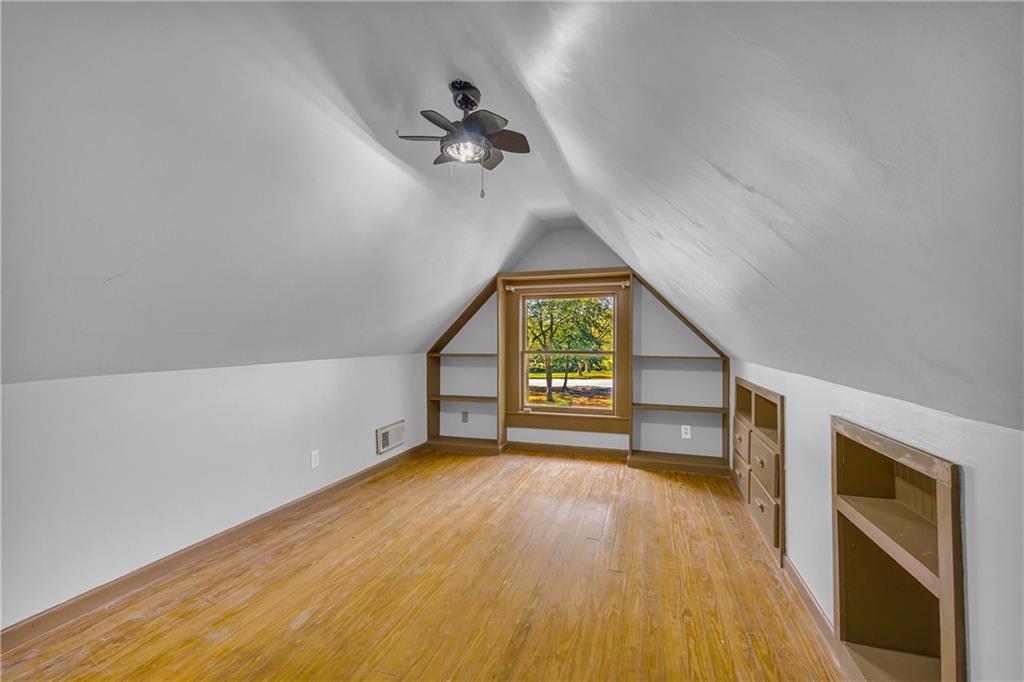 5921 Bostwick Road Bishop, GA 30621 - Photo 47 of 65 a view of an empty room with a window and wooden floor