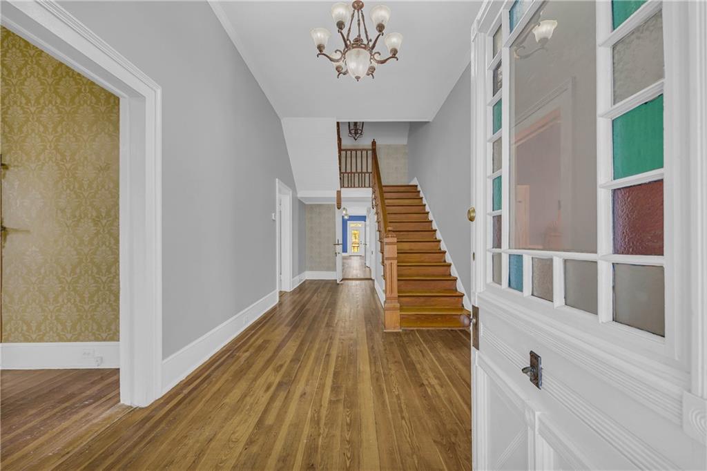 5921 Bostwick Road Bishop, GA 30621 - Photo 5 of 65 a view of a hallway with wooden floor and staircase
