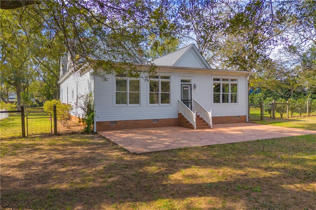 5921 Bostwick Road Bishop, GA 30621 - Photo 51 of 65 a house that has a tree in front of it