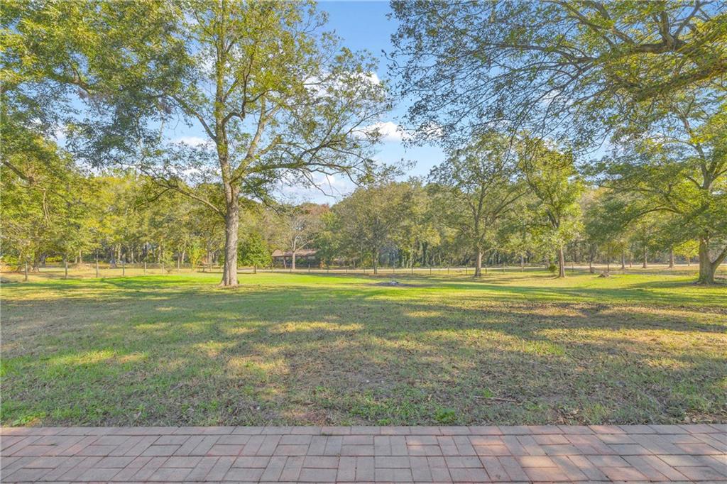 5921 Bostwick Road Bishop, GA 30621 - Photo 54 of 65 a view of a swimming pool with an outdoor space and seating area