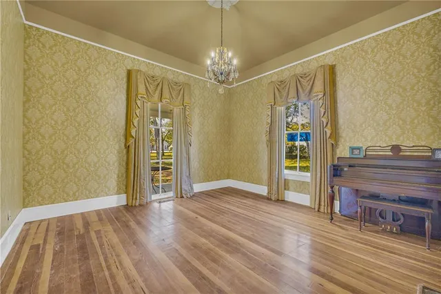 a view of a livingroom with wooden floor