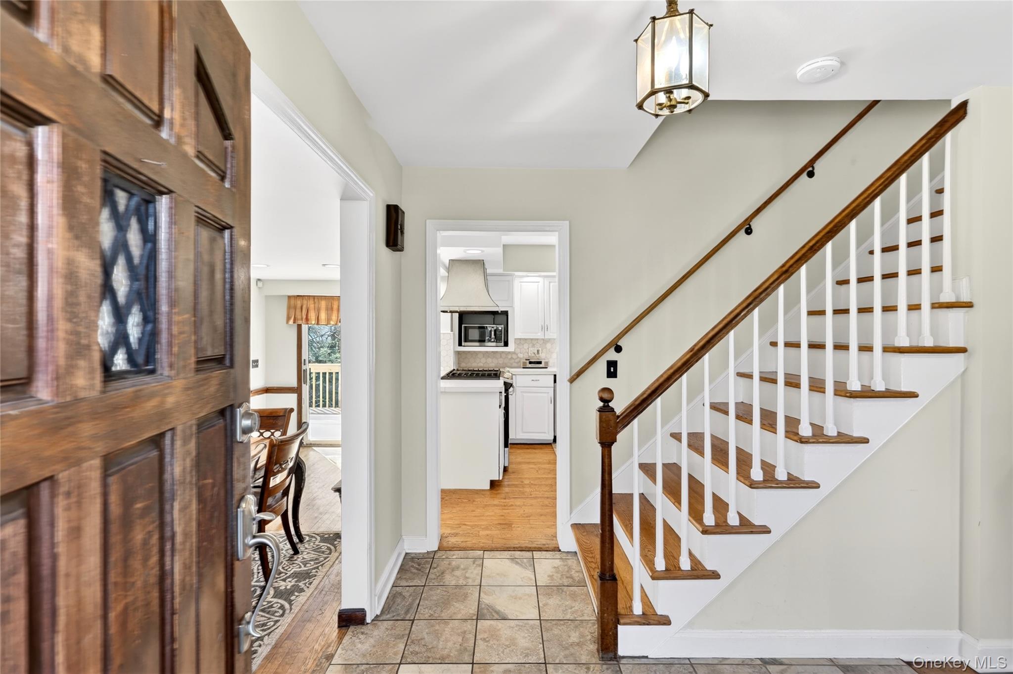 18 Taylor Road Elmsford, NY 10523 - Photo 2 of 29 Foyer entrance featuring light tile patterned floors and suspended lighting
