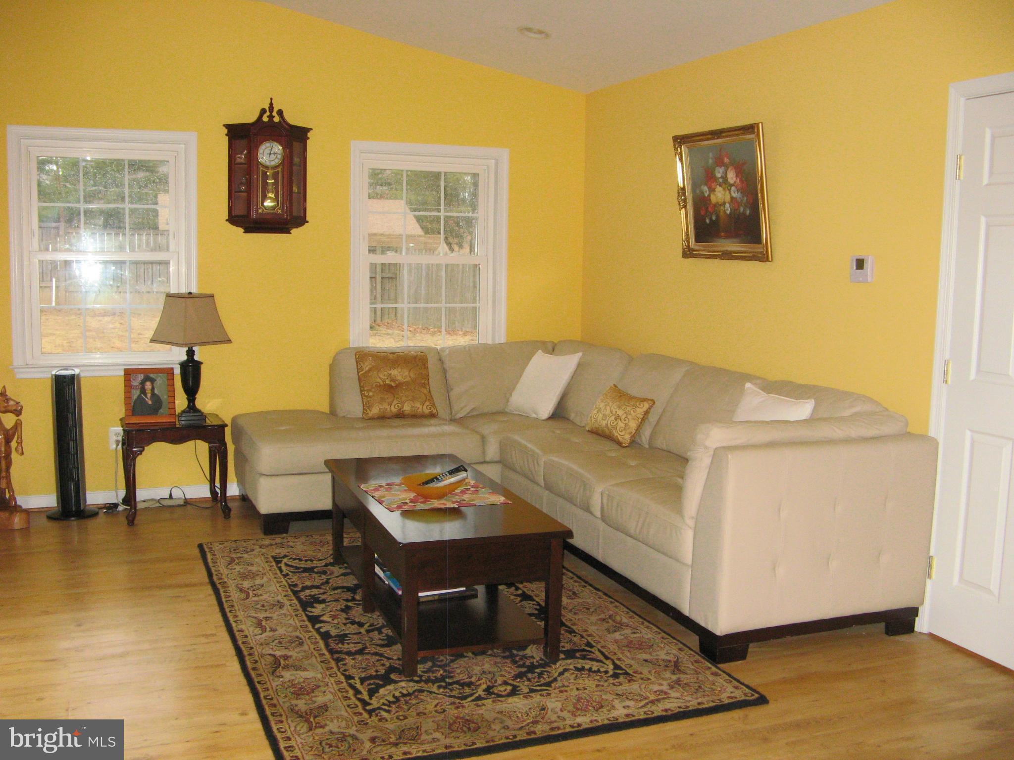 7302 Old Keene Mill Road Springfield, VA 22150 - Photo 15 of 28 a living room with furniture and a window