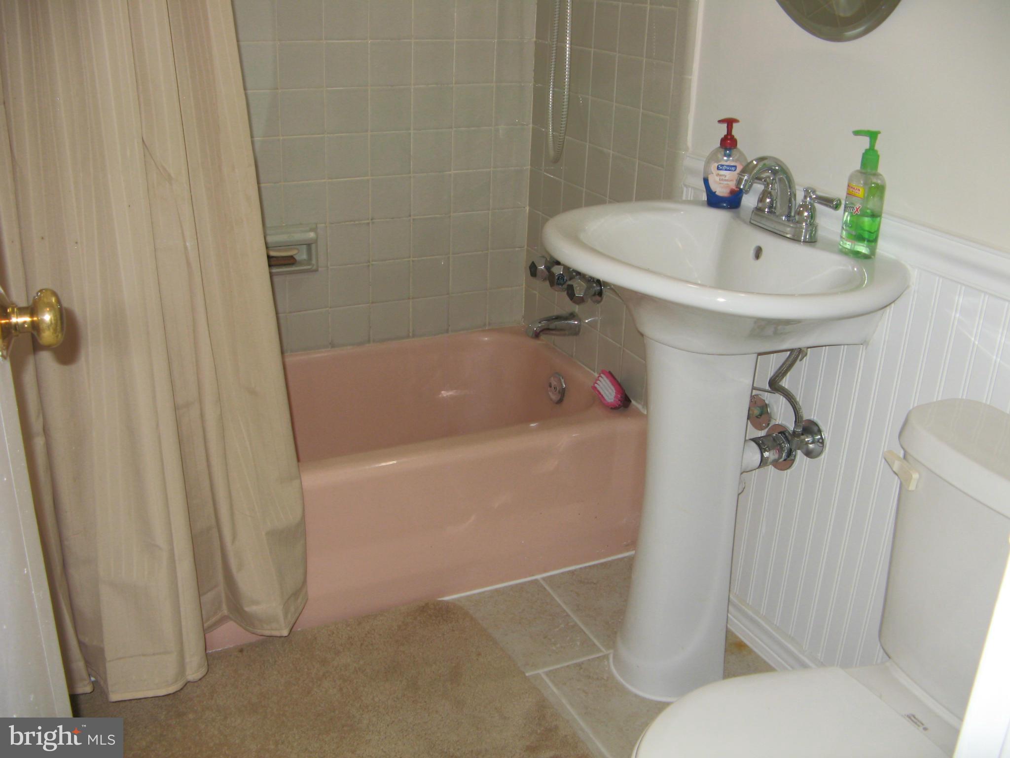 7302 Old Keene Mill Road Springfield, VA 22150 - Photo 26 of 28 a bathroom with a sink a toilet and shower